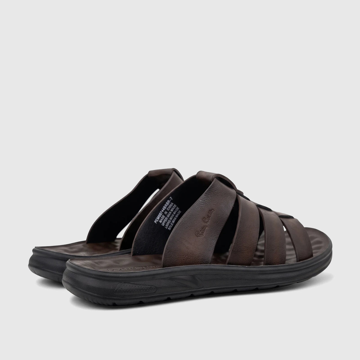 A pair of brown PC Men's Casual Comfort Sandals with multi-strap design, black soles, and visible branding. Shot from a low