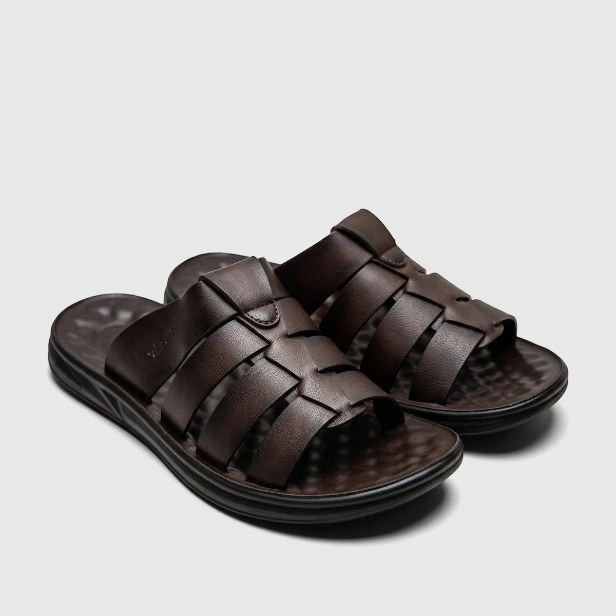 PC Men's Casual/Comfort Sandals PCM00744 Brown PM11. Pair of brown woven leather slide sandals with black soles, viewed from