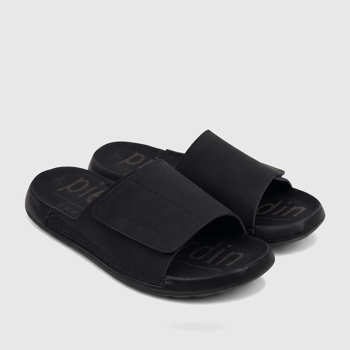 A pair of black PC Men's Casual Comfort Sandals (PCM00815) with a mono color design, featuring an adjustable strap.