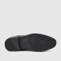 Black Pierre Cardin Boys Youth dress shoe, featuring a detailed view of its textured sole with branding.