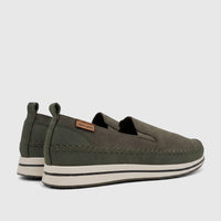 Pair of olive green Pierre Cardin women's casual loafers with decorative stitching, pull tabs, and a white platform sole,