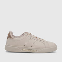 Beige Pierre Cardin ladies' casual sneaker, side view, featuring rose gold accents, laces, and perforated details.