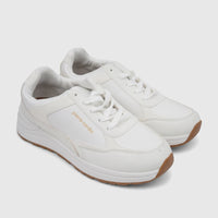 Pair of white Pierre Cardin women's casual sneakers with brown soles, white laces, and a gold logo on the side.