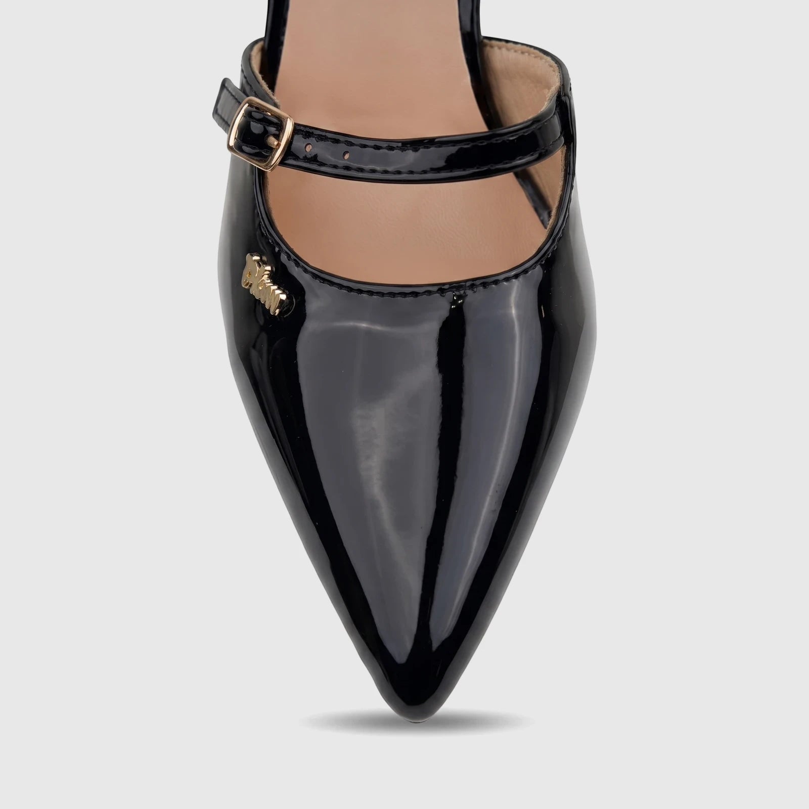 Close-up of a black patent leather Plum Ladies Dress Court Raven pump, featuring a pointed toe and mary-jane ankle strap.