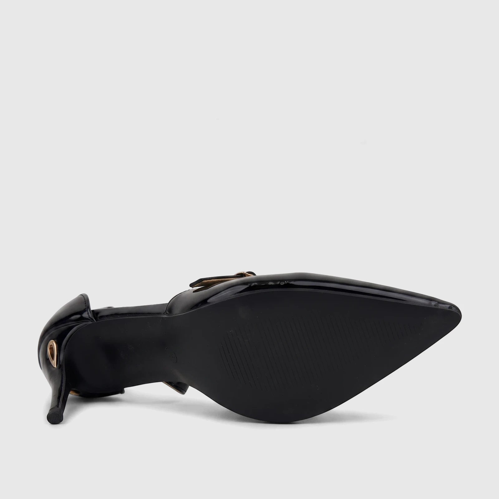 Black patent leather dress court shoes with a pointed toe and stiletto heel, displayed from a low-angle side view.