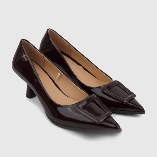 Plum Ladies Dress Court Cameron shoe in chocolate patent leather with a pointed toe and buckle detail, side view.