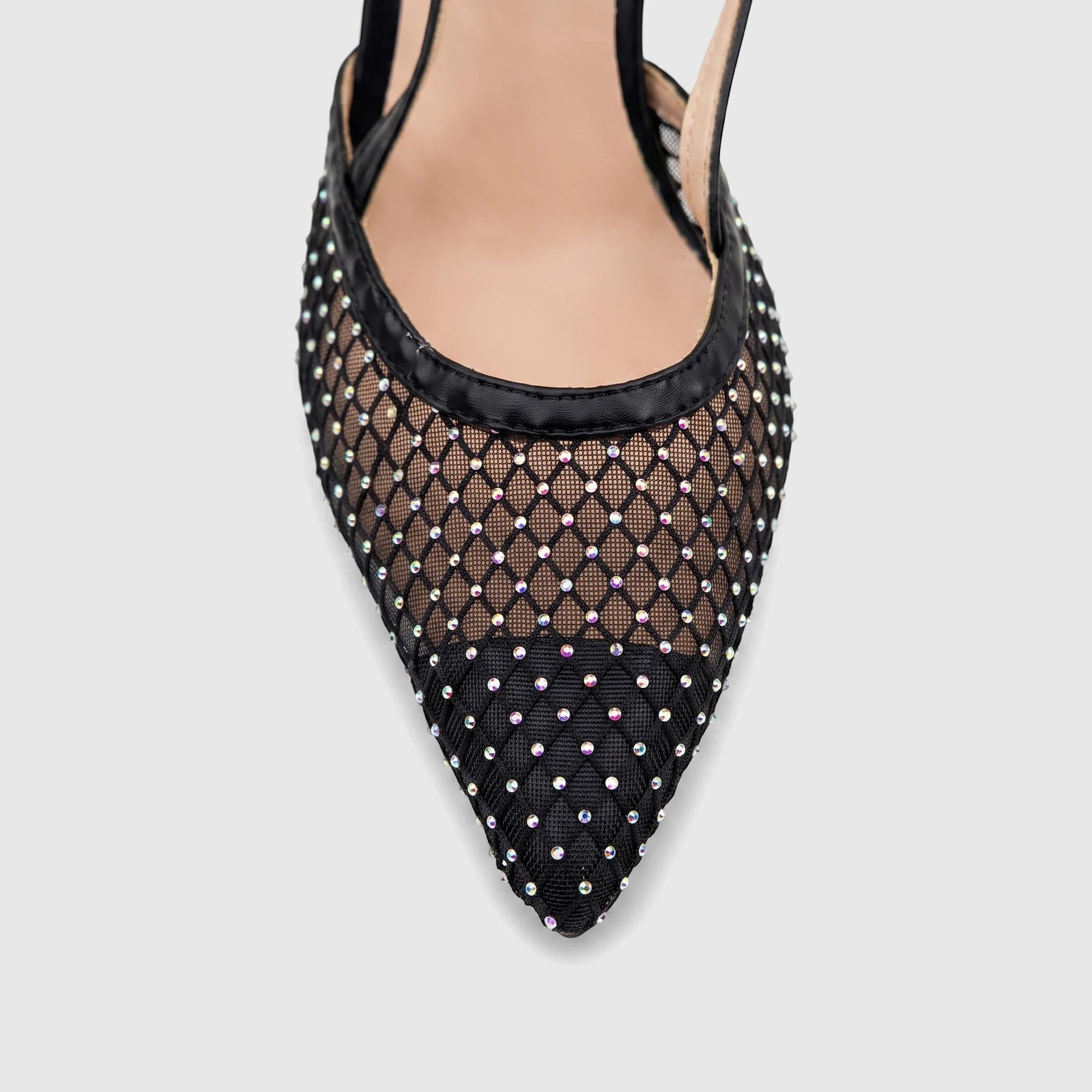 Close-up of a black mesh slingback court shoe with a pointed toe, embellished with iridescent rhinestones.