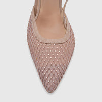Close-up of a nude Plum Zuri women's evening slingback court shoe with a pointed toe and rhinestone-studded mesh fabric.