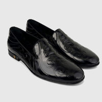 Pair of Roberto Cavalli Men's Black Leather Dress Loafers, featuring an embossed pattern and a gold-tone heel logo.