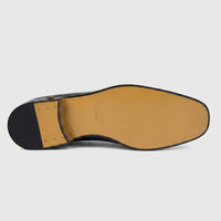 Roberto Cavalli Men's Black Leather Dress Slip-On shoe, viewed from the bottom sole, showcasing the brand and 'made in
