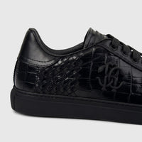 Close-up angled view of a Roberto Cavalli Men's Leather Sneaker 30720 in black, featuring woven and crocodile-textured