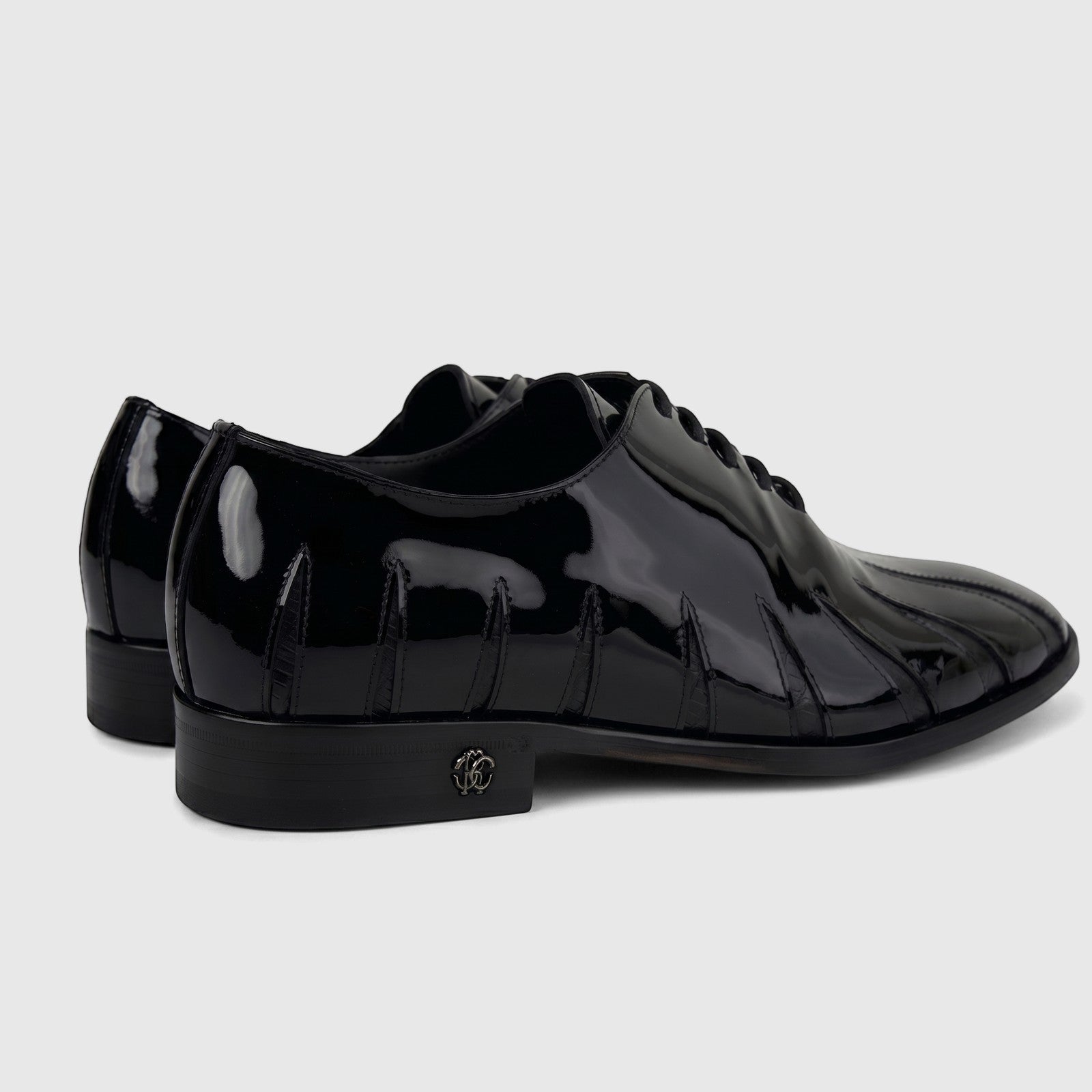 Roberto Cavalli Men's Leather Dress Oxford 30713 in black patent leather, showcasing its unique wavy details and heel logo.