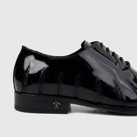 Roberto Cavalli men's black patent leather dress oxford shoe with distinctive stitching and RC logo emblem.