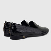 Roberto Cavalli Men's Leather Dress Loafer 30703. Black patent leather shoes with an embossed pattern and gold studded heels.