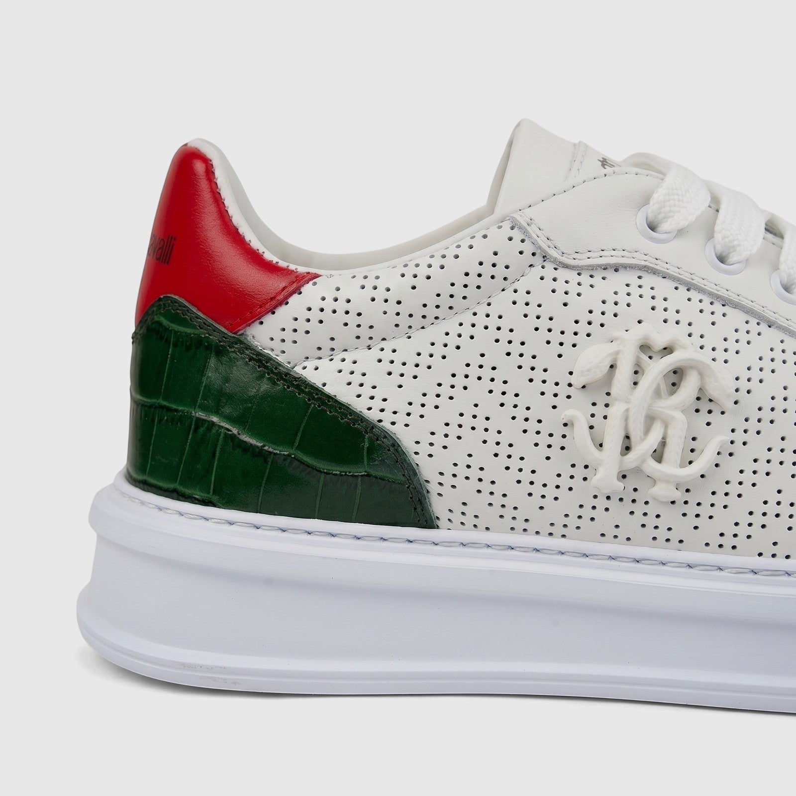 Roberto Cavalli men's leather sneaker in white with perforated sides, green crocodile-embossed accents, and a red heel.