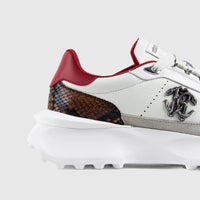Roberto Cavalli white sneaker with snakeskin and red accents, thick sole, and prominent RC logo, shown in a side view.