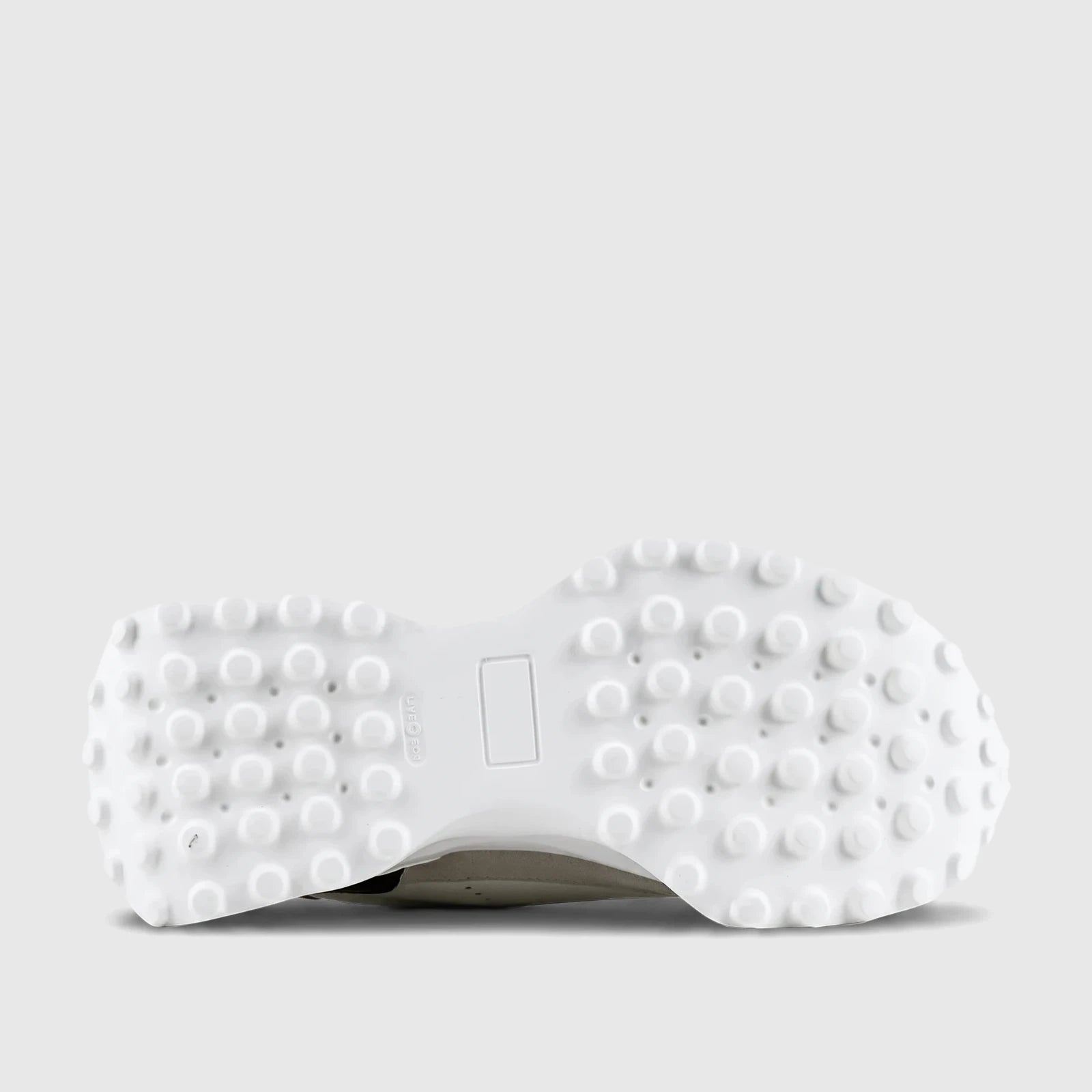 Bottom view of a white Roberto Cavalli sneaker sole, featuring textured nubs and a rectangular indent for grip.