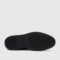 Bottom view of a black Rockport Men's Dress/Comfort Lace Up Leonard RP38 shoe, showcasing the durable black sole with a