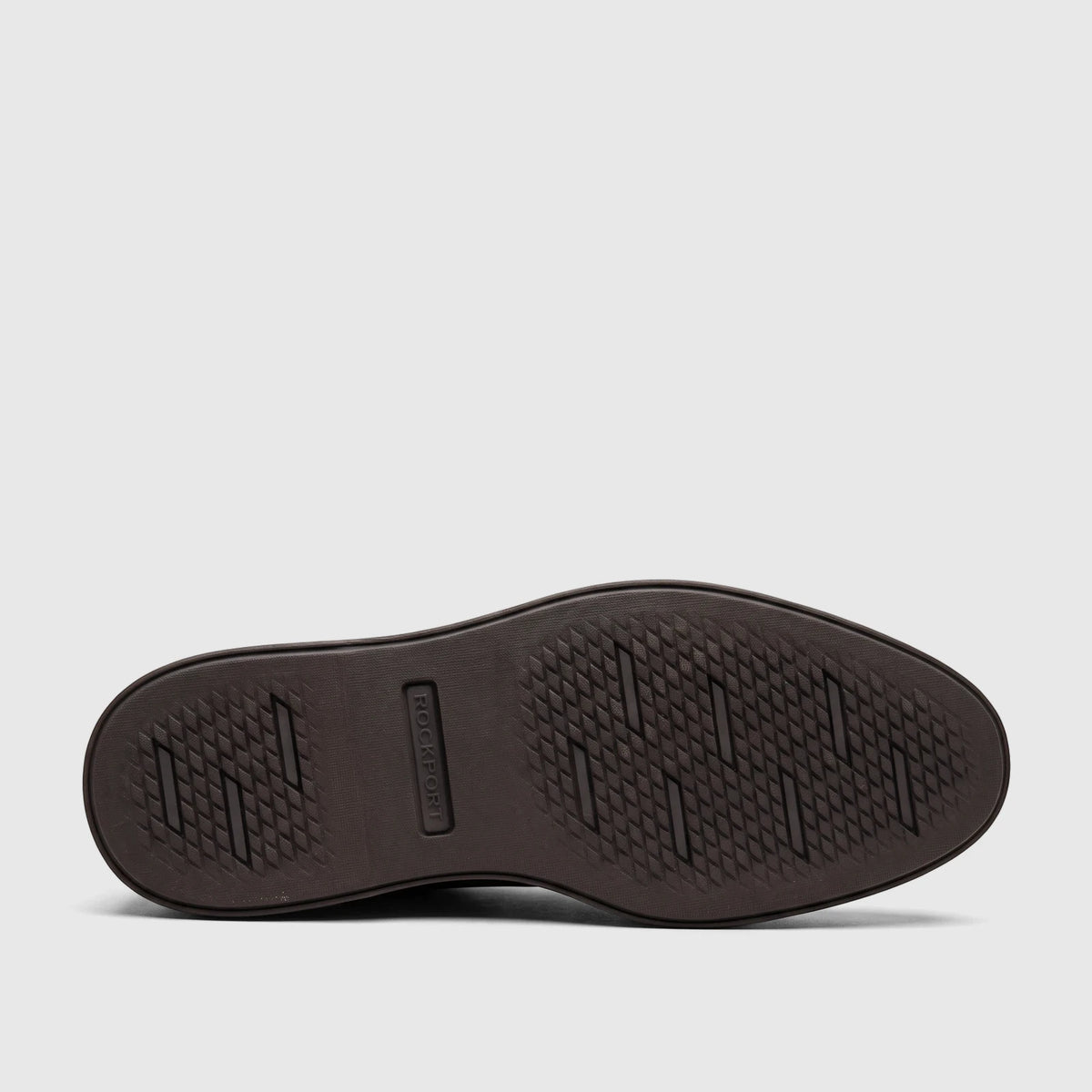 Dark brown Rockport Men's Leonard dress/comfort shoe, showing the rubber sole with a geometric traction pattern and embossed