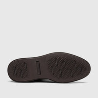 Dark brown Rockport Men's Leonard dress/comfort shoe, showing the rubber sole with a geometric traction pattern and embossed