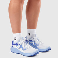 Salomon Alphaglide W ladies sneaker in Ancient Water blue with white mesh upper, shown worn from side angle