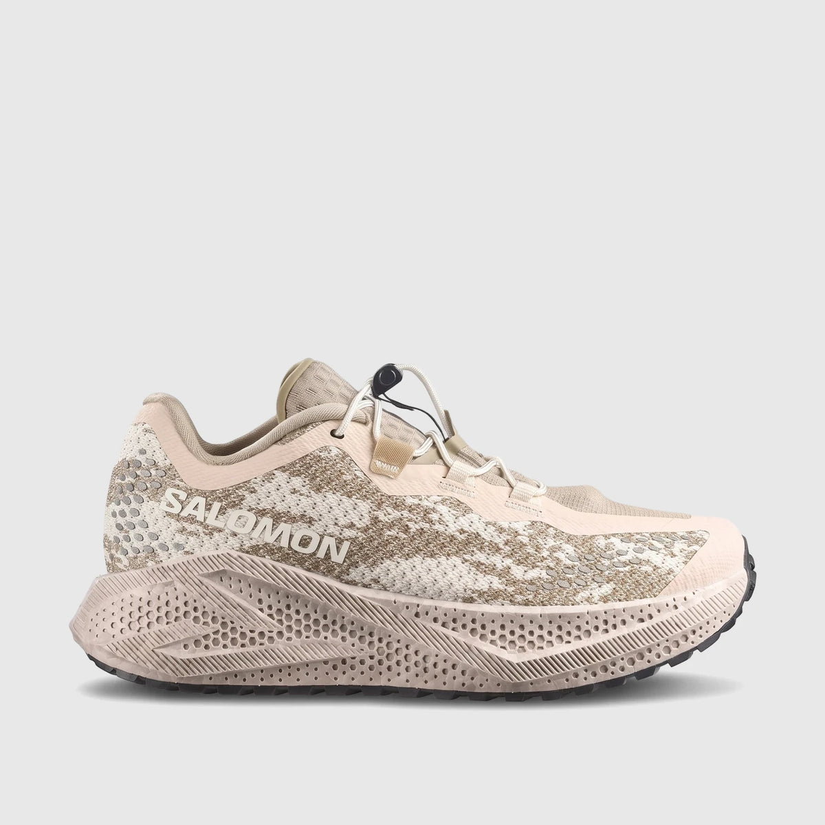 Salomon Ladies Aero Glide 4 GRVL running shoe in Tapioca/Desert Tan/Burro, featuring a textured sole and quick-lace system.