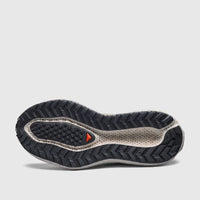 Bottom view of a Salomon Ladies Sneaker Aero Glide 4 GRVL with dark grey tread and beige midsole.
