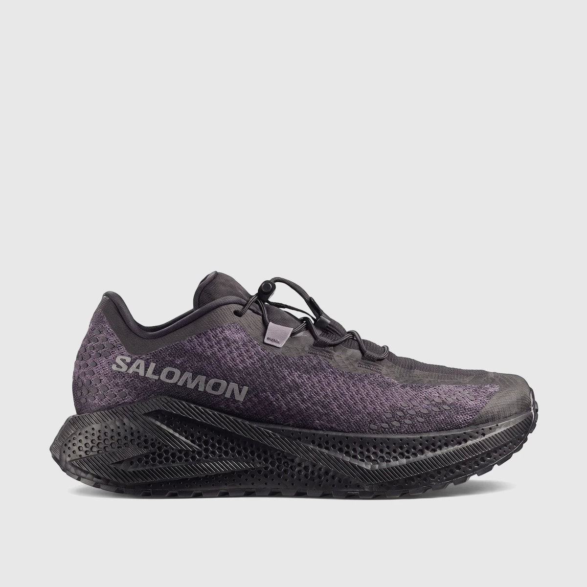Salomon Men's Sneaker Aero Glide 4 in black and asphalt, featuring a textured upper and a distinct honeycomb-patterned sole,
