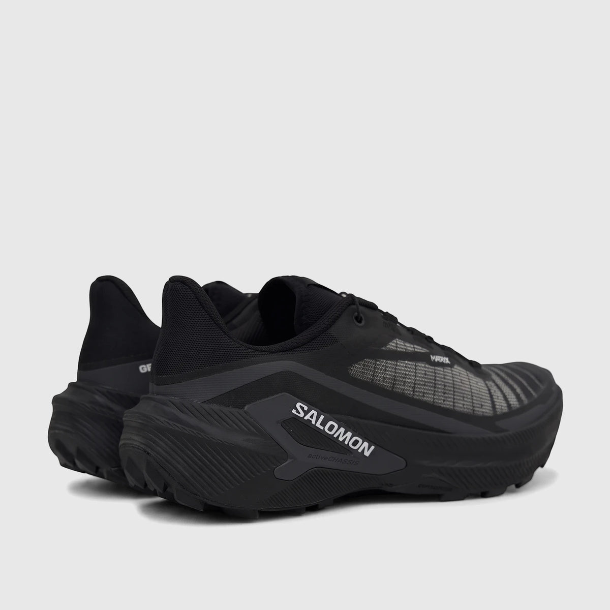 Salomon Men's Sneaker Genesis 2 492998 in black, featuring a thick sole and prominent branding, viewed from the side.