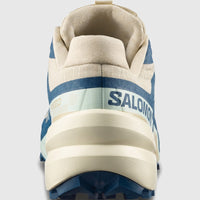 Salomon Men's Sneaker Speedcross 6 in bog blue and beige with aqua accents, rear heel view.