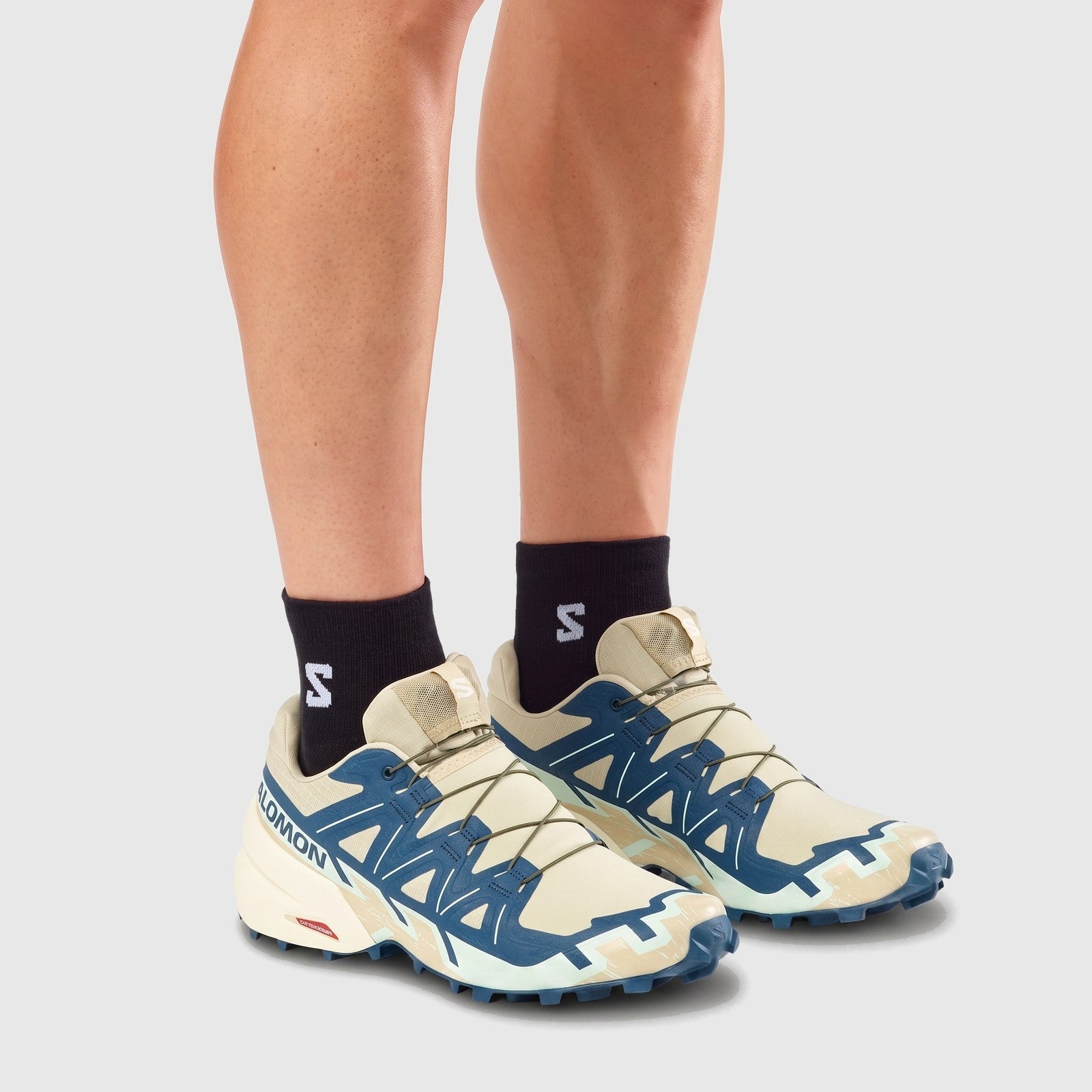 Salomon Men's Sneaker Speedcross 6 in bog and gibraltar sea with aqua accents, worn view showing laces and tread.