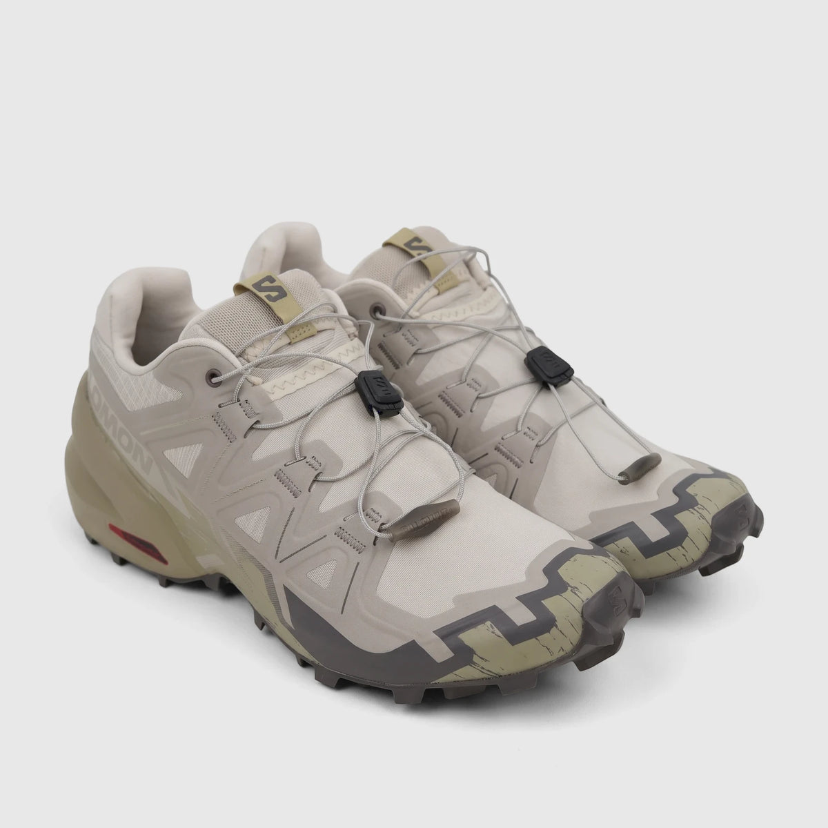 A pair of Salomon Men's Sneaker Speedcross 6 in Silver Cloud, Paloma, and Slate Green, featuring a quick-lace system.