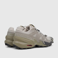 Salomon Men's Speedcross 6 trail running sneakers in silver cloud, paloma, and slate green, shown from a rear-side view.
