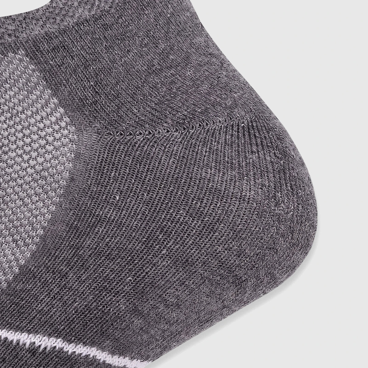 Close-up view of a grey Salomon Men's Xa Sonic knit sock with white stripe details, showcasing the fabric texture.