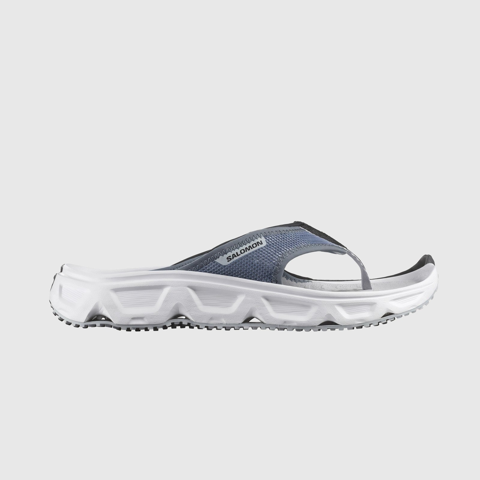 Salomon Reelax Break 6.0 men's comfort flip flop in blue mesh with white cushioned sole, side view.