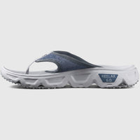 Salomon Men's Comfort Flip Flops Reelax Break 6.0 in blue and white, side view with mesh strap and thick sole.