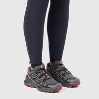 Salomon Speedcross Peak W ladies sneaker in asphalt and black mesh with pink accents, side view worn on feet.