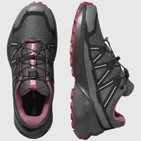 Salomon Speedcross Peak W ladies sneaker in asphalt black with pink accents, shown in top and side view.