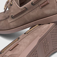 Two Sebago Docksides Portland Nubuck boat shoes in total brown taupe, shown stacked in a close-up.