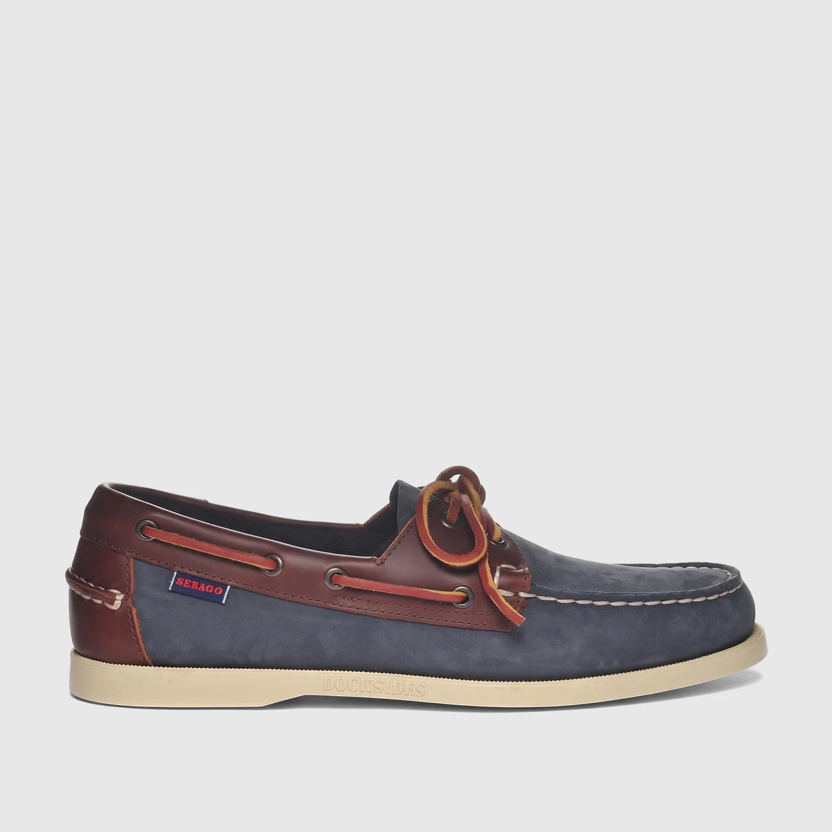 Men's Sebago Docksides Portland boat shoe in blue nubuck and brown leather, featuring classic lacing and white stitching,