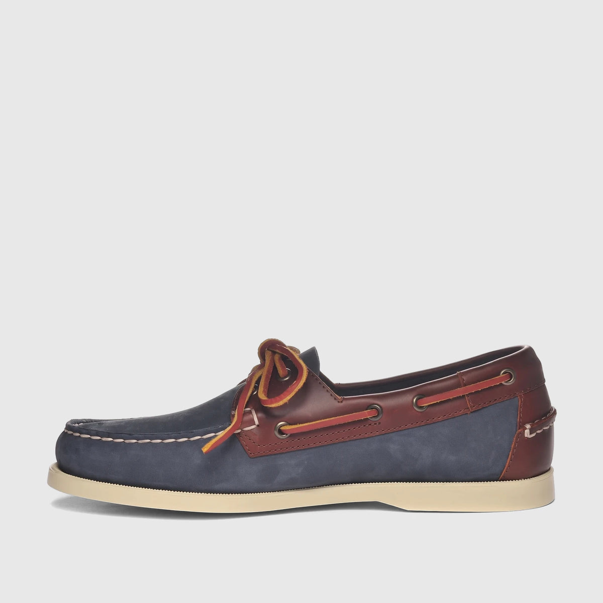 Men's Sebago Docksides Portland boat shoe in blue nubuck and brown leather, featuring red and yellow laces, side view.
