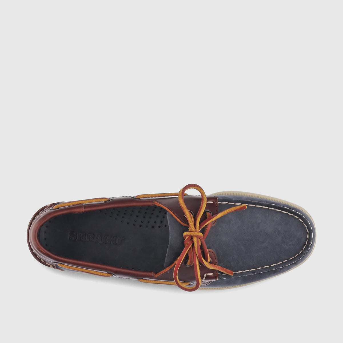 Sebago Men's Docksides Portland Nubuck boat shoe in blue universe brown with yellow-orange laces, top-down view.