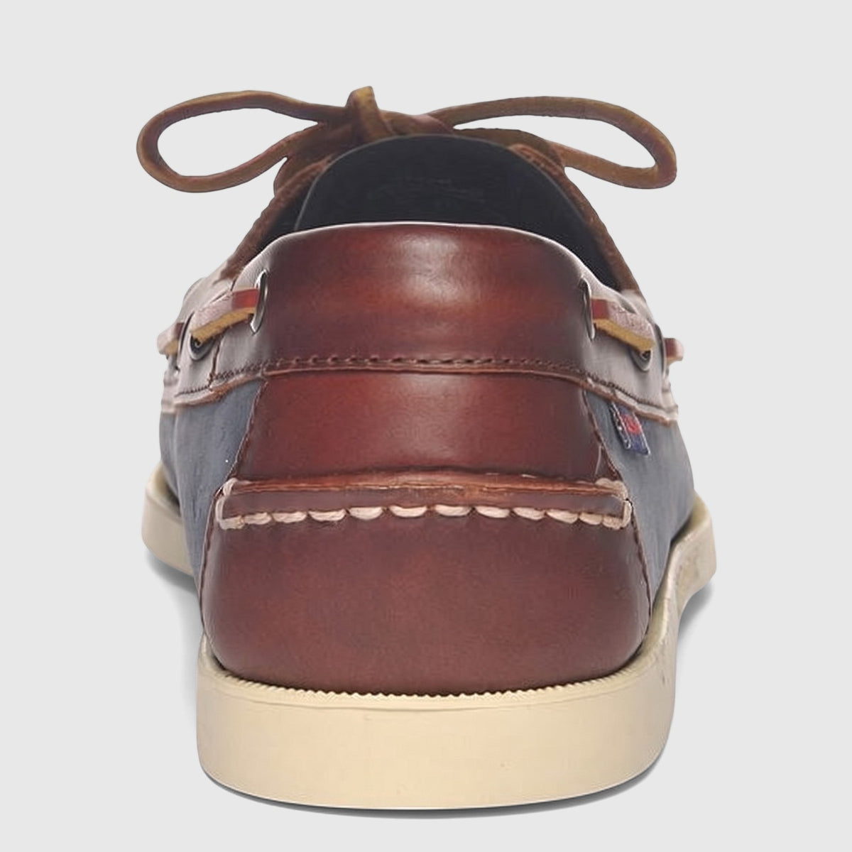 Sebago Men's Docksides Portland boat shoe, featuring blue nubuck and brown leather details, captured from the back view.