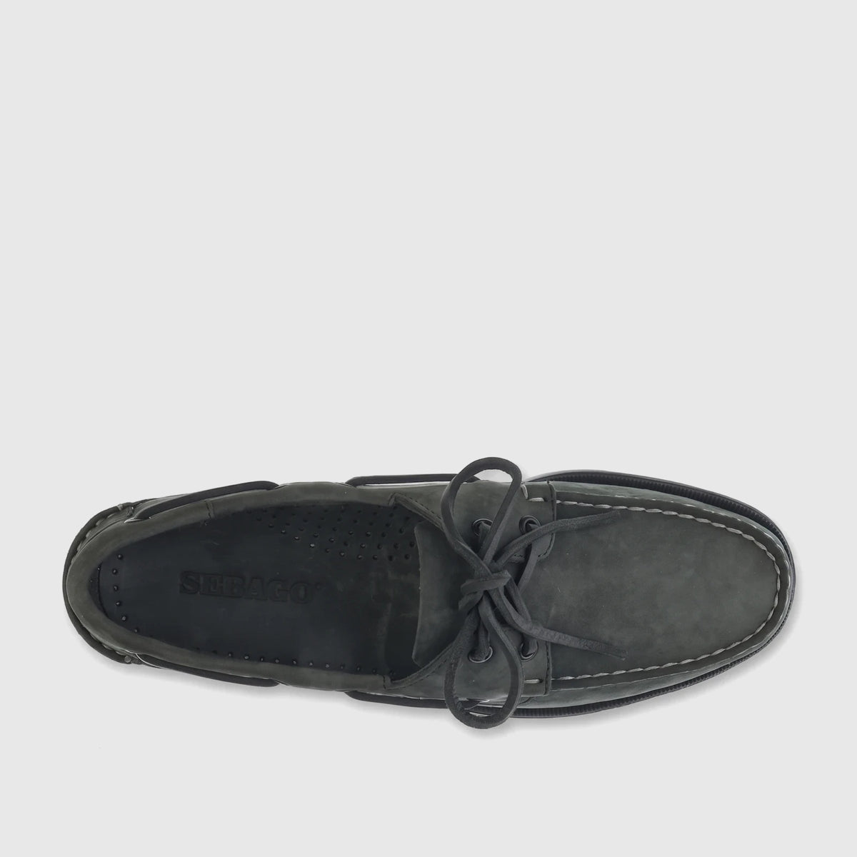 Overhead view of a single Sebago Men's Docksides Portland Nubuck boat shoe in total dark grey with tied laces and white