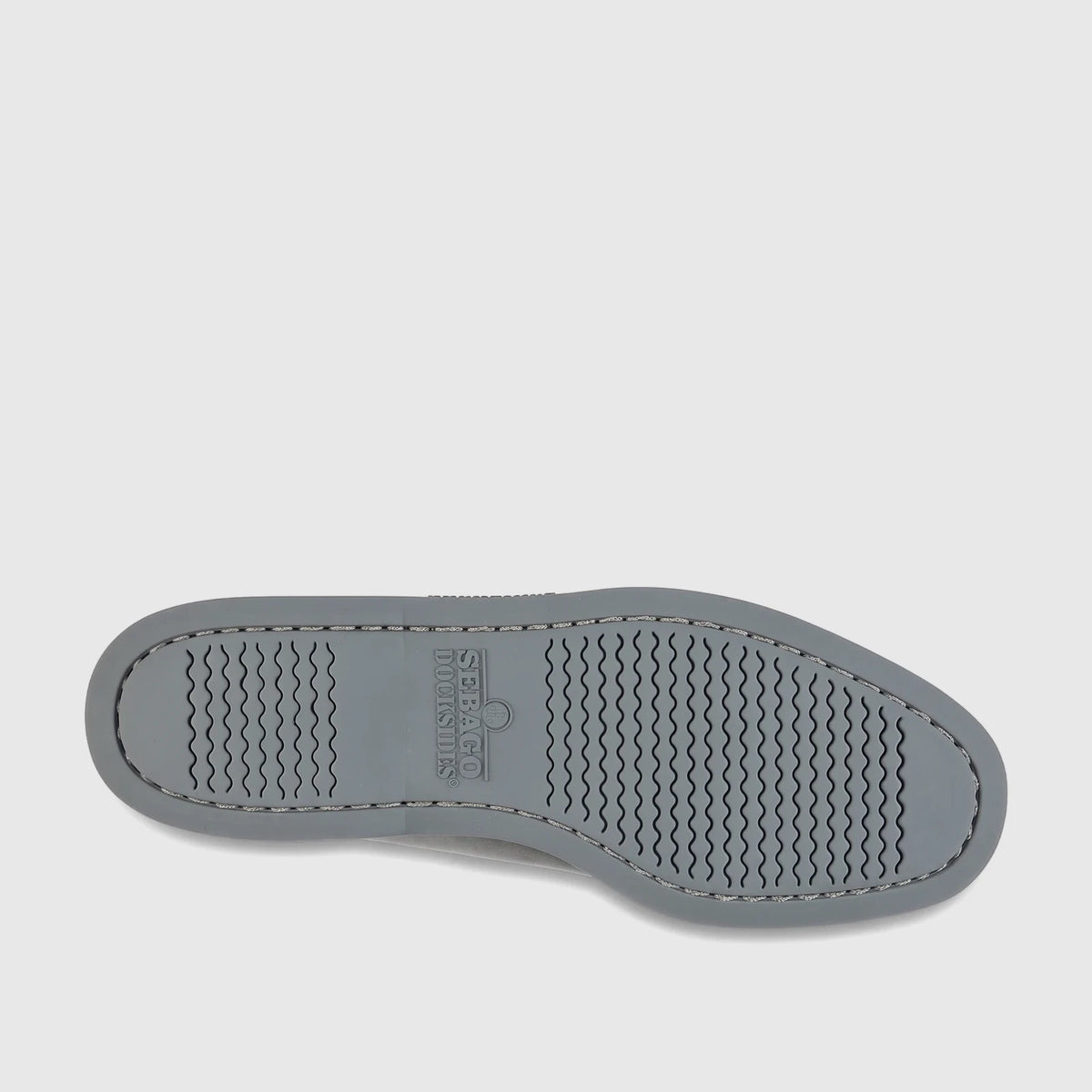 Sole of a Sebago Men's Docksides Portland Nubuck shoe in total mid grey, featuring wavy tread pattern and brand logo.