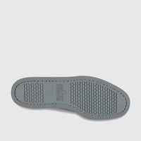 Sole of a Sebago Men's Docksides Portland Nubuck shoe in total mid grey, featuring wavy tread pattern and brand logo.