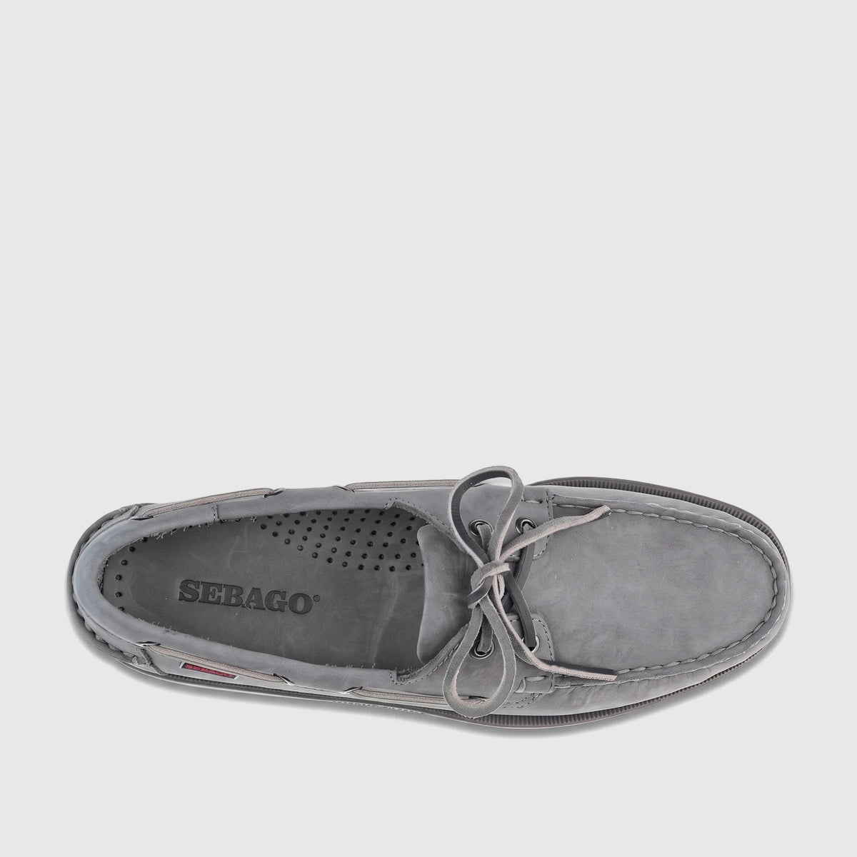 Top view of a single Sebago Men's Docksides Portland boat shoe in total mid grey nubuck with visible laces and stitching.
