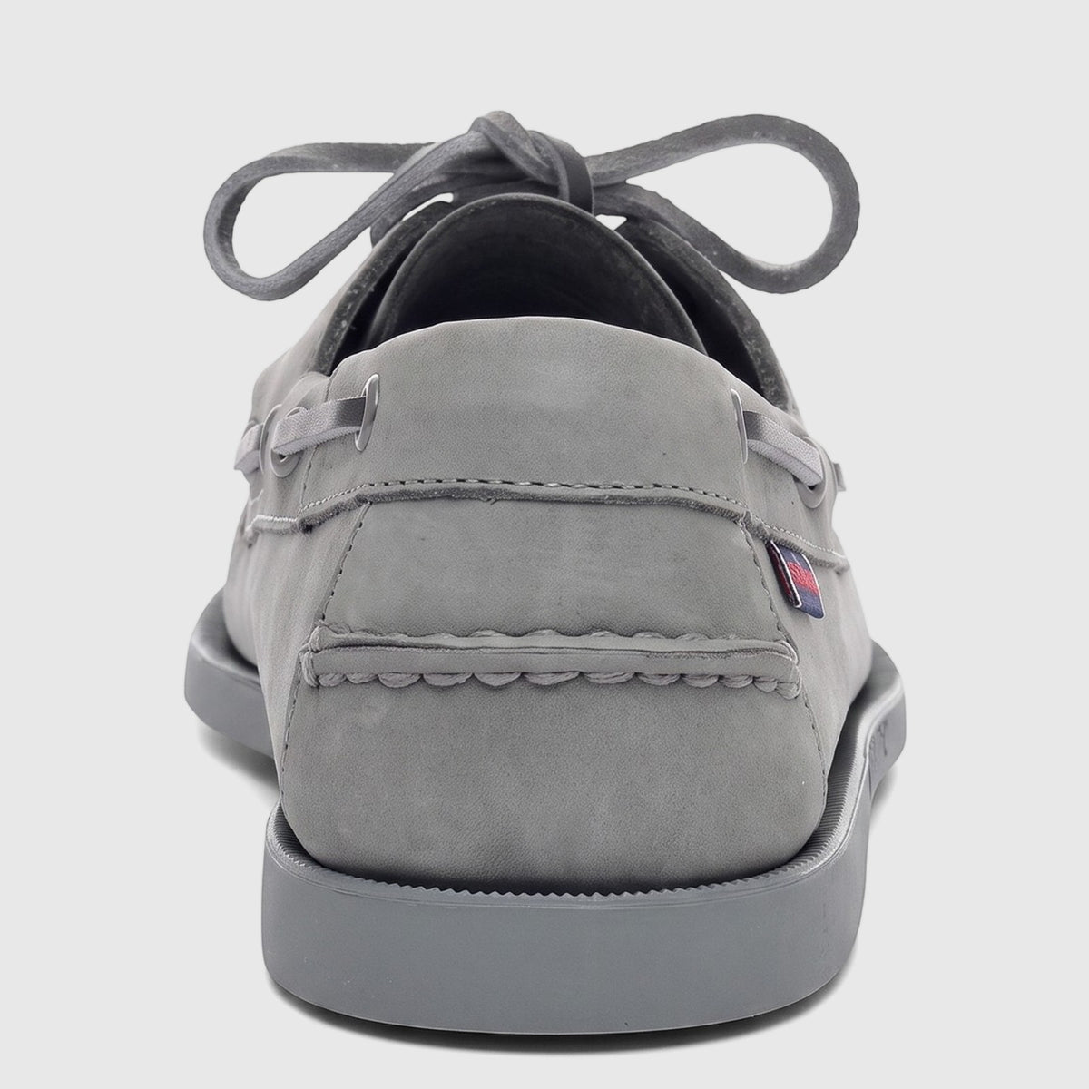 Sebago Men's Docksides Portland Nubuck boat shoes in mid-grey, rear view, with tied laces and a non-slip sole.