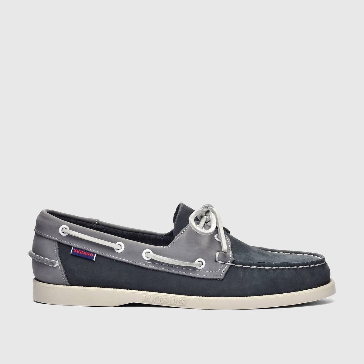 Sebago Men's Portland Spinnaker nubuck boat shoe in navy and grey, displayed in a side profile view.