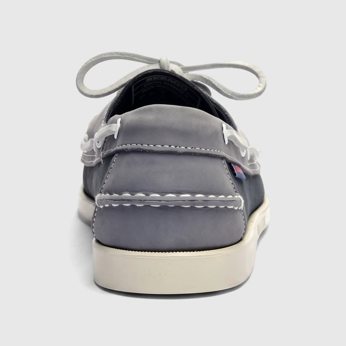 Sebago Men's Portland Spinnaker Nubuck boat shoe in navy grey with white laces, shown from the back view.